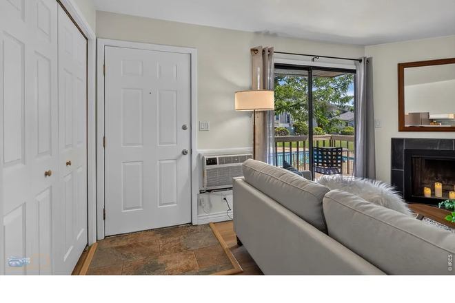Living room with view to the outside through the sliding door - Available Month to Month - Quite, Convenient, Comfortable & Affordable 2nd floor unit with Deck Condo