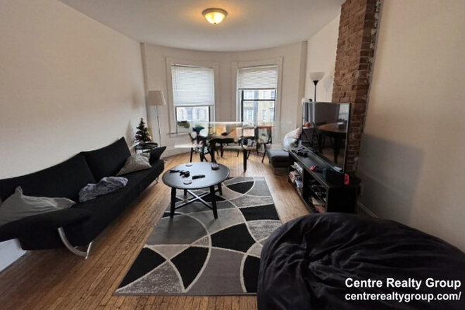Living Room - Modern 4-Bedroom Apartment on Huntington Ave w/ In-Unit Laundry