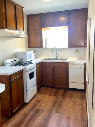 Large kitchen  with tons of storage. Microwave included. - Treetop apartment walking distance to Rice U.