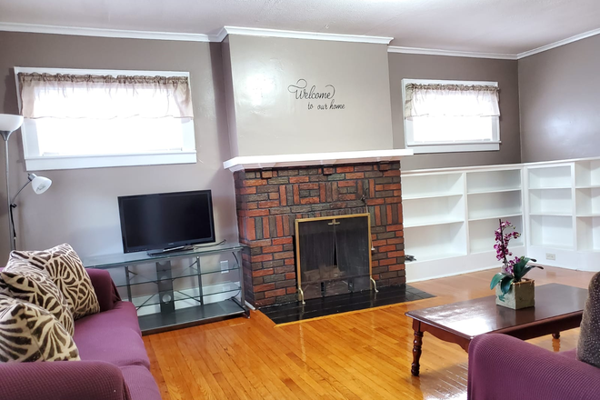 Livingroom - Large 4 bedroom Apartment, Furnished, free Laundry & Parking