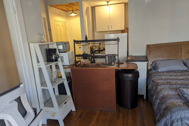 Kitchen and Sleeping area - Location Location Location! Apartments