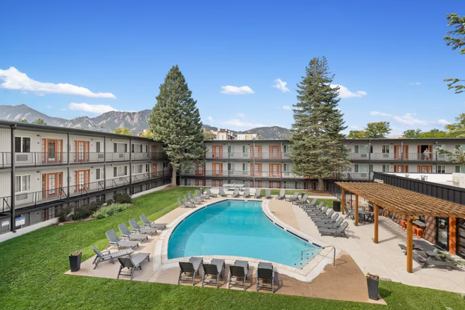 View of apartments and pool from front office - The Lodge Apartments Summer Sublet