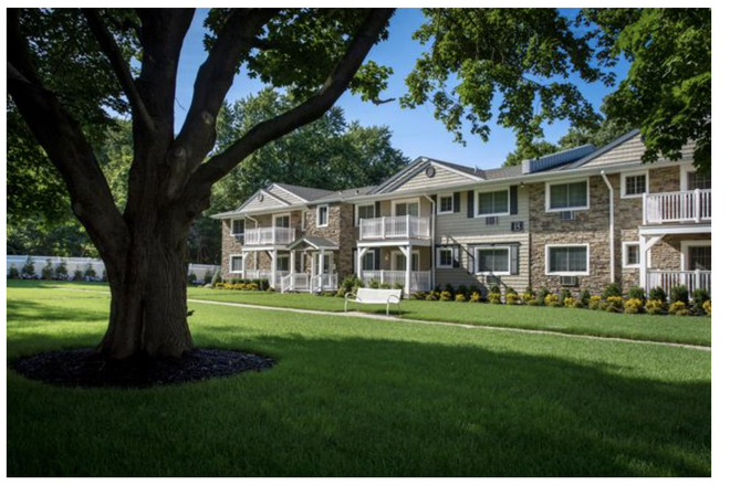 Located on the first floor, this unit also features a balcony, providing outdoor space. - FAIRFIELD LAKE GROVE Apartments