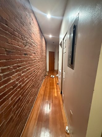 In-unit Hallway - Brownstone Close to Campus Apartments