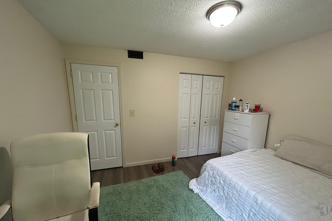 The bedroom comes with a spacious closet. - Riverside Apartments