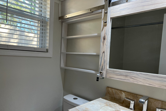Bath with barn door vanity mirror/cabinet - 614 Agnes Rd. 4-Plex Triplex