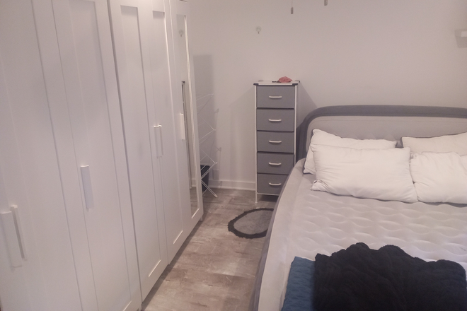 Bedroom and Closets - Complete Furnished Basement Apartment