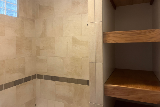 Bathroom shower and storage - Charming & Spacious Home Just 1.5 Blocks from DU!