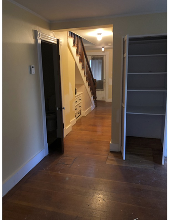 downstairs hall, doorway to 1/2 bath - Large, well cared for 3-4 BDRM in residential neighborhood Duplex