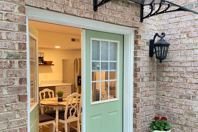 Entry with awning - Bright, fully equipped, furnished Basement Apartment