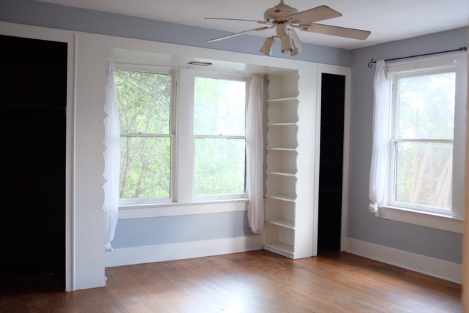 Living room with built in storage - Spacious and Sunny 1/1 Apartment. Gas Range. In Unit Laundry.