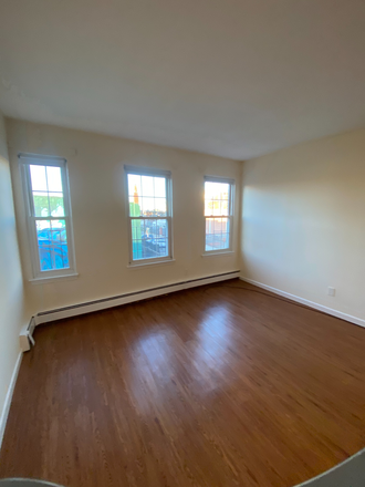 Living room - No fee 1 bed near NEU, ht/hw incl, lots of laundry Ref #201941509 Apartments