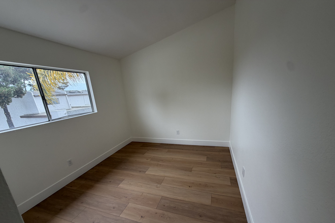 Bedroom 3 with a view window and a closet space - Remodeled UTC Townhouse Near UCSD