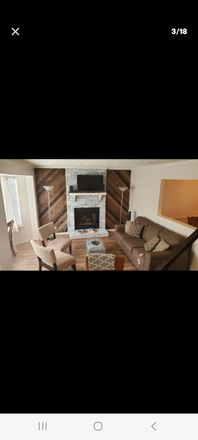 Living room with fireplace - 2 storey fully furnished 3bd, 2ba house w/ entertainment room for rent in Nashville, 15 min. to VU