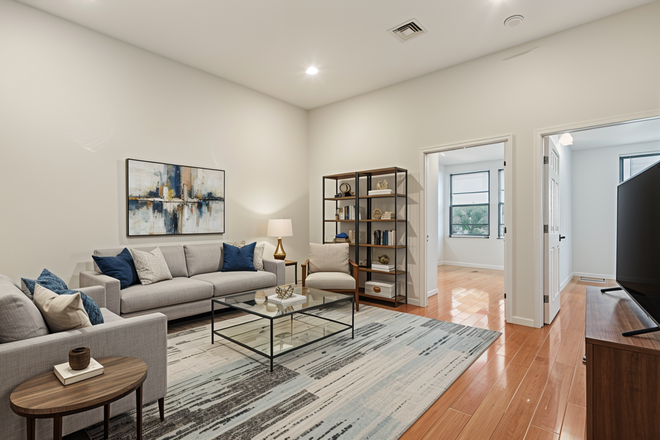 Living Room (Note: Staged photos are digitally rendered and intended to illustrate how the unit may look furnished.) - 1204 Chestnut Apartments