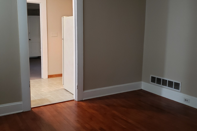 Living room with hardwood floor - 1 bd/1 ba terrace apt in owner's home near Emory campus. Rent is $1325 which includes utilities