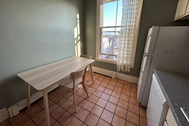 Kitchen Table + Window - Furnished Studio Apartment Minutes from Harvard and MIT!