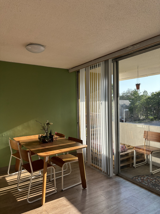 Dining room table and balcony - Courtyards Townhouse Style Bedroom B Spring/Summer 25