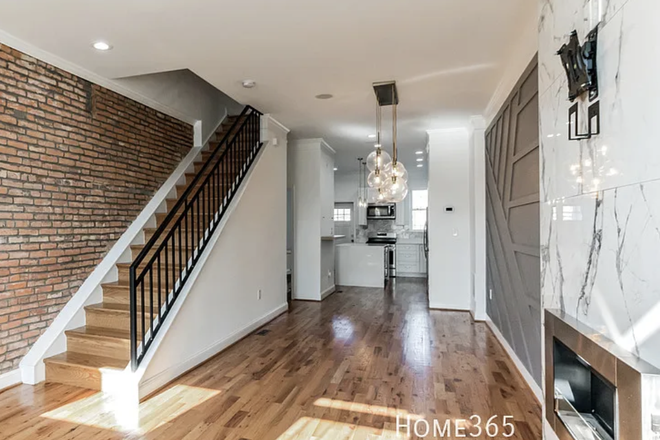 Main level, open concept living, dining, and kitchen - Townhome close to The Johns Hopkins Main Hospital