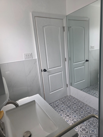 Bathroom view captured from shower space, the large body mirror helps assure you are dressed for success! - One 'Full Size' Bedroom with Shared Full Bath //0.3 Miles to Adelphi Shuttle