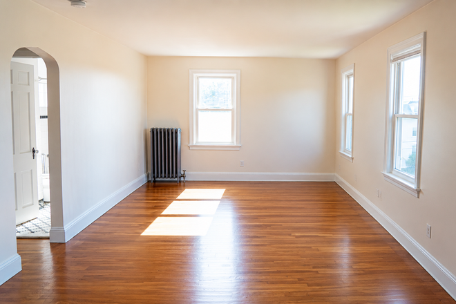 Living Room Empty - Sun-Filled Edgewood Condo | 1BR | 2 Parking Spaces | Walk to Roger Williams Park