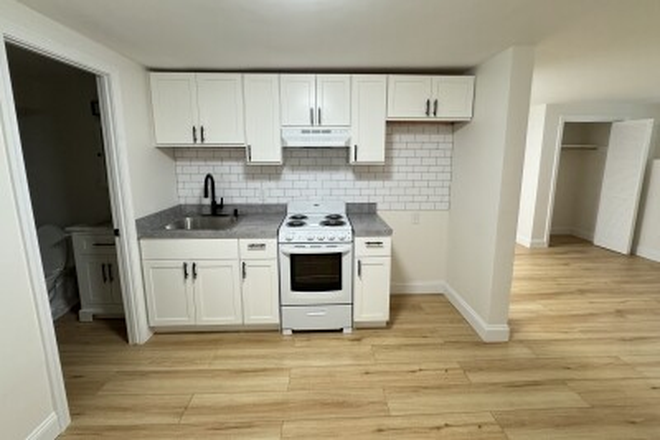 Visit hubrealtyproperties.com - Beautiful and spacious garden level studio, full kitchen with new appliances Apartments