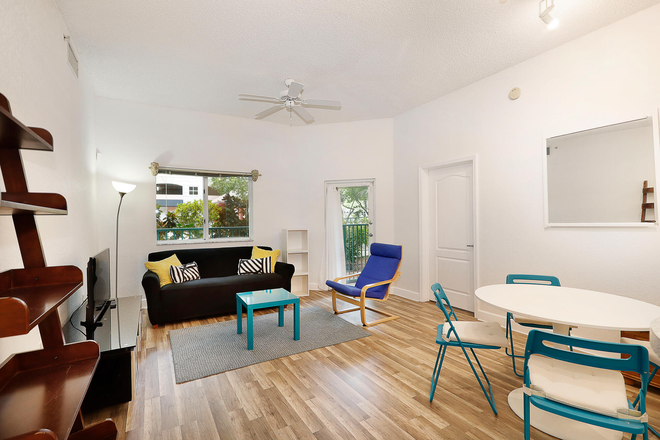Living Room - Furnished 2 BR / 2 Bath in Suite - Near UM Campus at The Valencia
