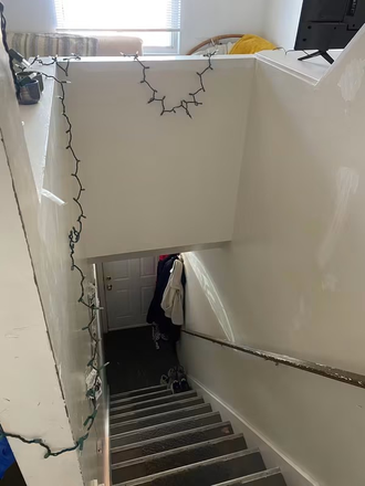Stairs down to front door - Cambridgeport apartment, across river from campus