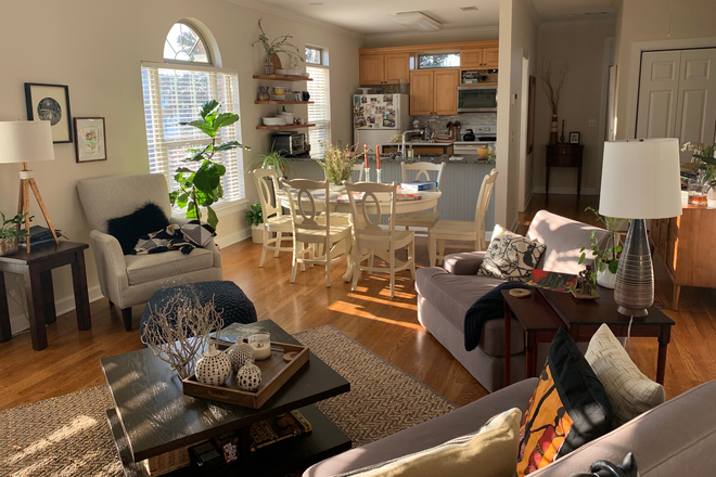 Main room looking in to kitchen (unfurnished) - Sunny Sylvan Park 2bd/2ba apartment -- Fantastic location! For rent by owner. OCT 2025