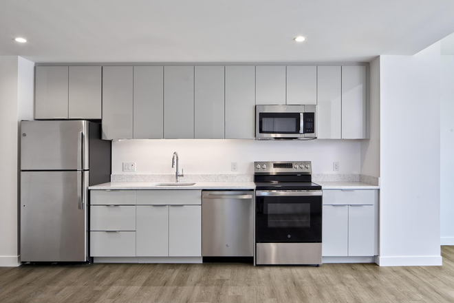 Kitchen and Common room (AI generated image, taken from website but it is same as unit) - 100 South Campus Drive Apartments