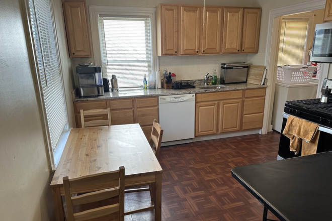 living - RENOVATED 3 BED WITH IN-UNIT LAUNDRY AND 1 PARKING INCLUDED! AVAIL 9/1/26!