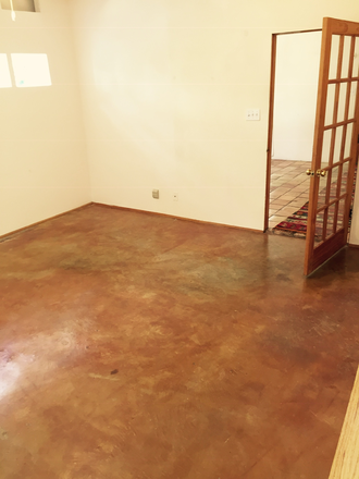 Living Room door to Dining Room - Quiet 2 story garden house blocks from Rice/TMC; new kitchen & W/D, 9’ ceiling, Saltillo, terrazzo
