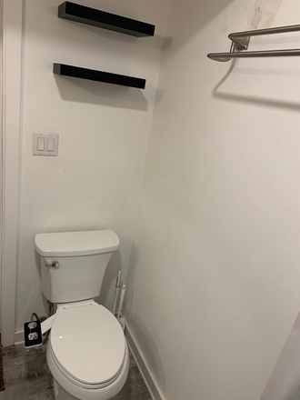 Private bathroom with sink, commode, shower and tub. - Furnished Basement Apartment