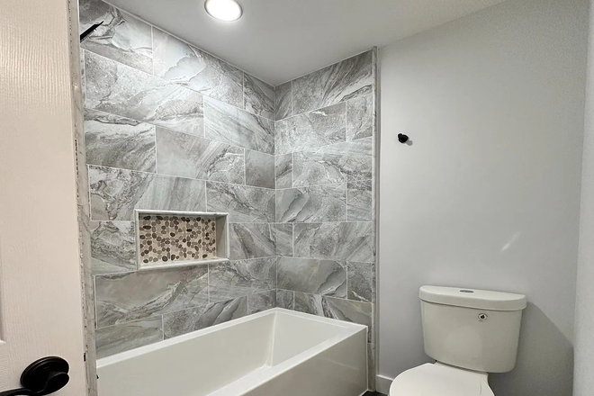 Main floor bathroom - Beautifully Renovated 2-Story House with 5 BR/4 Full Baths