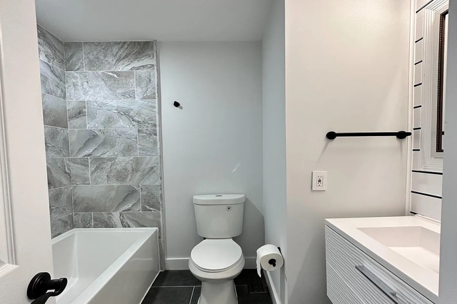 Main floor bathroom - Beautifully Renovated 2-Story House with 5 BR/4 Full Baths