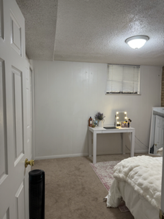 Bedroom view through doorway - SUBLET FOR 1 BEDROOM IN 3 BEDROOM APARTMENT WITH 2 BOYS. 2 minute walk to campus!