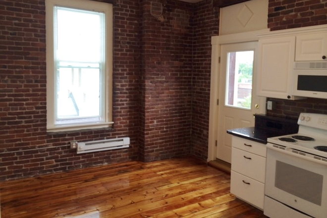 Kitchen, exposed brick - Avail July 1, 2026 4 Bedroom, granite countertops, eat in kitchen, d/w new tile bath, high ceilings