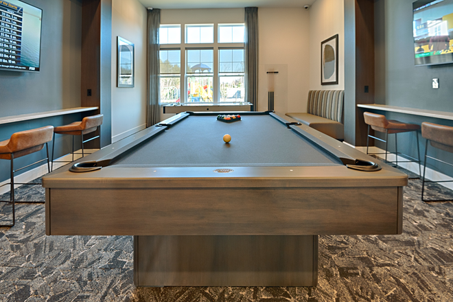 Pool table, bar seating, and TVs on both walls. - Unfurnished 2BR apt-Forge Circle-Pennington