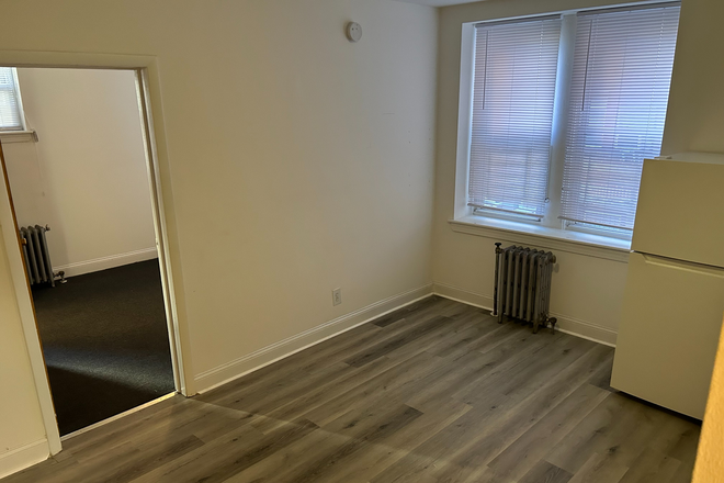 living room - Trinity Place Apartments - 1-Bedroom Heat Included!