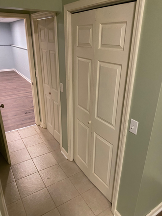 Bedroom hallway; two full closets with upper shelves/hanger capable clothing storagw - Basement Apartment; downtown Kennesaw.