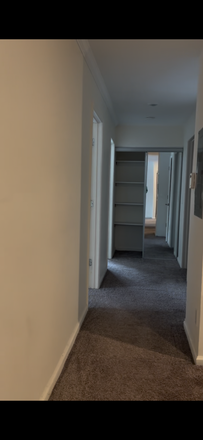 All photos are screenshots from a recorded video walkthrough of the apartment. This is the hallway leading to the bedrooms - BerryTree Apartments