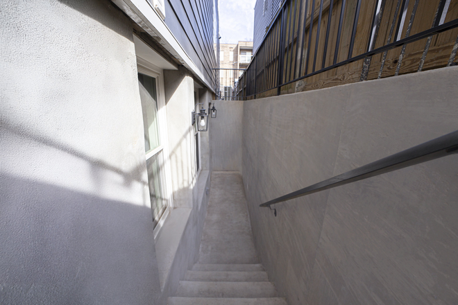 Stairwell to apartment - Brand New/Atlas District Apartments