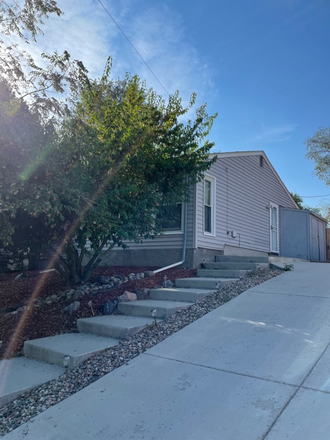 Front/side of house - Fully furnished 3 bedroom, 2 bathroom W/D in unit and utilities paid.