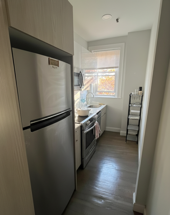 Renovated kitchen with upgraded appliances and sunny views overlooking private yard - Available now or Jan! Reduced Rent $2,850/month Apartments