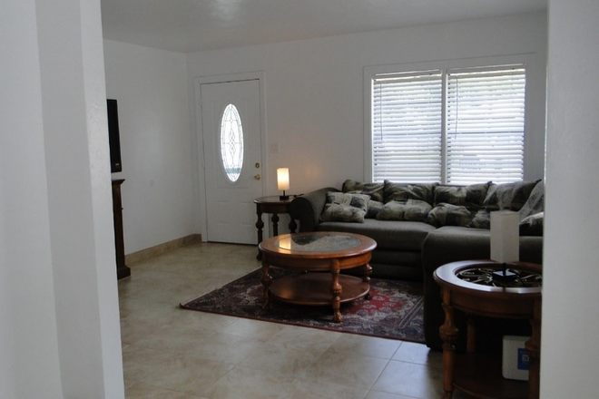 living room - AVOID TRAFFIC & CAMPUS PARKING! 2 blocks from UM, completely renovated 3/2 house w/ large yard!