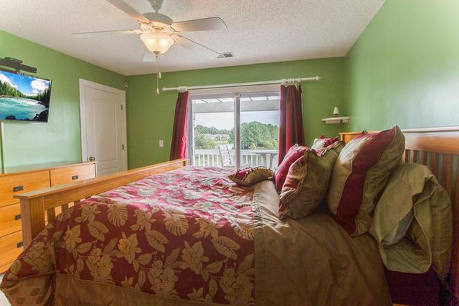 Old photo of master bedroom (walls are light blue, curtains are gray, no bedframe, white bedding) - Room Available in Whitney Lake Townhome