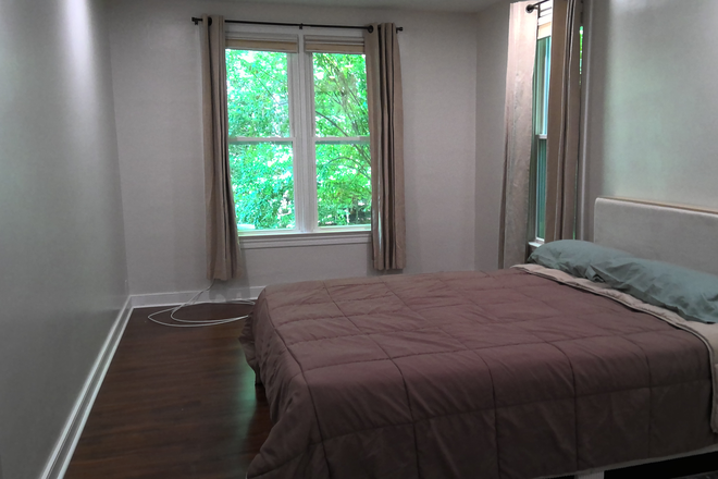 Bedroom looking left - Easy walk or bike to campus. Quiet woodland view. House