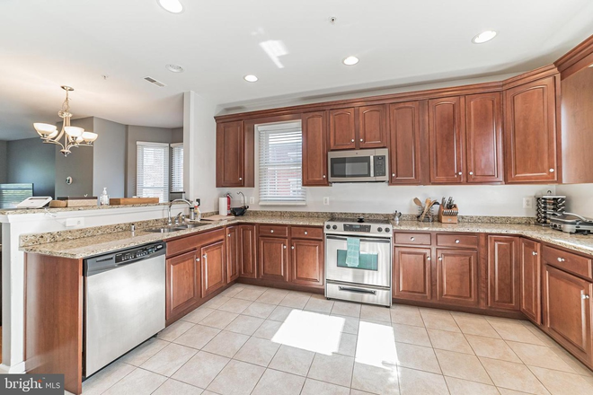 Kitchen - Modern 3-bed Ridgely’s Delight townhouse with private garage, updated interiors, and walkable.