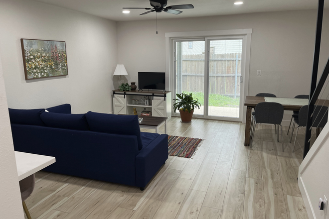 Living & Dining Area opening to private fenced patio - Furnished Renovated Collins St,Women's Townhouse,Individual Leases - Earliest availability 8/2026