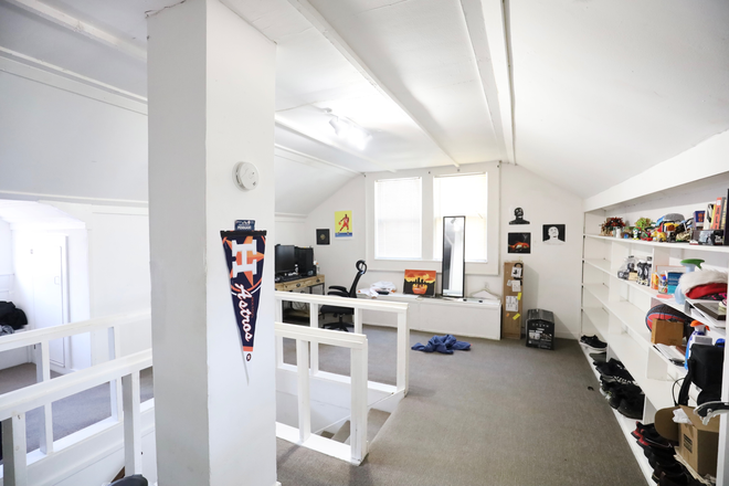 Upstairs Bedroom Loft; Ample shelving with a sunlit touch, perfect for study essentials, you can create your own cozy seating area! - 1601 Colquitt House | 4BR · 2BA · 2 Kitchens · Cool, Comfortable,Close to Campus